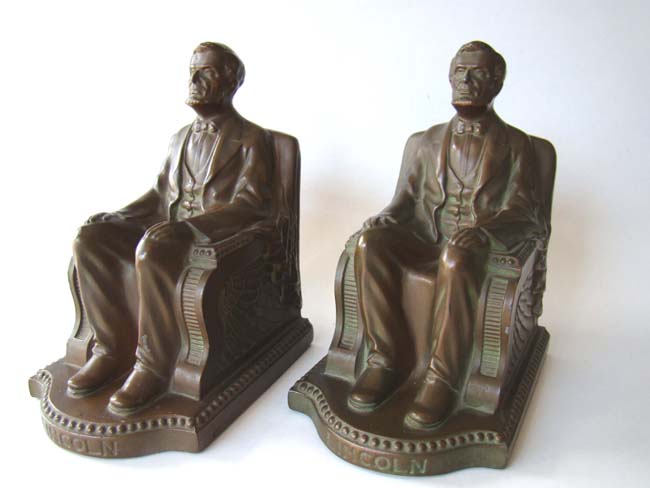 A lovely pair of bronze patinated antique bookends by Nuart circa 1924 depicting 'Lincoln in the chair.'